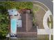 Aerial view showcases the home's well-maintained roof, pool, landscaping, and neighborhood location at 1686 Spottswood Cir, Palm Harbor, FL 34683