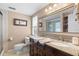 Bathroom features a double vanity with granite counters and a walk-in shower at 1686 Spottswood Cir, Palm Harbor, FL 34683