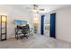 Cozy bedroom featuring neutral carpet, a ceiling fan, and blue curtains at 1686 Spottswood Cir, Palm Harbor, FL 34683