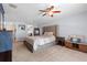 Relaxing main bedroom with carpet, natural light, a king bed, and neutral decor at 1686 Spottswood Cir, Palm Harbor, FL 34683