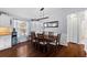 Bright dining room with a large wooden table and views of the backyard at 1686 Spottswood Cir, Palm Harbor, FL 34683