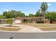 Charming single-story home featuring a well-manicured front lawn and a two-car garage at 1686 Spottswood Cir, Palm Harbor, FL 34683
