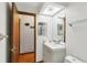Bathroom featuring modern vanity, mirror, and doorway to hallway at 170 Foxfire Ln, Oldsmar, FL 34677