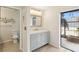 Bathroom featuring modern vanity with access to outside area at 170 Foxfire Ln, Oldsmar, FL 34677