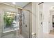 Bathroom showcasing a luxurious shower with a window view, modern fixtures and a tiled wall at 170 Foxfire Ln, Oldsmar, FL 34677