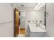 Modern bathroom with stainless steel hardware, updated lighting and hardware floors at 170 Foxfire Ln, Oldsmar, FL 34677