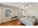 Bedroom with natural light, ceiling fan, and hardwood floors at 170 Foxfire Ln, Oldsmar, FL 34677