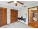 Bright bedroom featuring built-in desk, closet, and connections to other rooms at 170 Foxfire Ln, Oldsmar, FL 34677