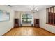 Bright dining room with hardwood floors, chandelier, and large window for ample natural light at 170 Foxfire Ln, Oldsmar, FL 34677