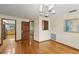 View of dining room with hardwood floors, and entrances to living room and kitchen at 170 Foxfire Ln, Oldsmar, FL 34677