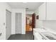 Bright laundry room with washer, sink, and closet space at 170 Foxfire Ln, Oldsmar, FL 34677