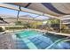 The screened-in pool and patio area feature a covered area, providing a relaxing and enjoyable outdoor space at 170 Foxfire Ln, Oldsmar, FL 34677
