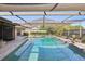 Screened-in pool and patio features a covered space, providing a perfect spot for relaxation and enjoyment at 170 Foxfire Ln, Oldsmar, FL 34677