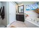 Bathroom featuring tub, shower, and vanity with granite counters at 18002 Forest Retreat Ln, Tampa, FL 33647