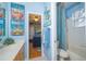 Whimsical bathroom with beach themed decor offers a glimpse into the themed bedroom at 18002 Forest Retreat Ln, Tampa, FL 33647