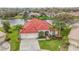Aerial view of beautiful single Gathering home with red tile roof and lush landscaping at 18002 Forest Retreat Ln, Tampa, FL 33647