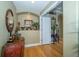 Inviting foyer featuring hardwood floors and decorative accents at 18002 Forest Retreat Ln, Tampa, FL 33647