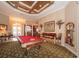 Spacious game room featuring a pool table, bar area and elegant chandelier at 18002 Forest Retreat Ln, Tampa, FL 33647