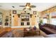 Cozy living room with a large media center, plush seating, and plenty of natural light at 18002 Forest Retreat Ln, Tampa, FL 33647
