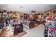 Spacious living room filled with memorabilia and collectibles, creating a unique and personalized atmosphere at 18002 Forest Retreat Ln, Tampa, FL 33647