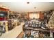 Spacious Gathering room filled with collectibles and decor, creating a unique and personalized atmosphere at 18002 Forest Retreat Ln, Tampa, FL 33647