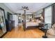 Spacious main bedroom suite featuring tray ceilings and a four-poster bed at 18002 Forest Retreat Ln, Tampa, FL 33647
