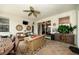 Inviting covered patio with comfortable seating, ceiling fan, and elegant decor, perfect for outdoor relaxation and entertaining at 18002 Forest Retreat Ln, Tampa, FL 33647