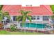 Backyard aerial view features a swimming pool and spa with a screened enclosure at 18002 Forest Retreat Ln, Tampa, FL 33647