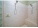 Tiled shower with dual shower heads and bench at 18002 Forest Retreat Ln, Tampa, FL 33647