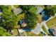 Aerial shot of a home within property lines highlighting the surrounding landscaping and adjacent homes at 23253 Granite Pl, Land O Lakes, FL 34639