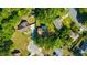 An aerial view of a home showcases the surrounding landscaping, neighborhood, and driveway at 23253 Granite Pl, Land O Lakes, FL 34639
