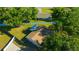 This aerial shot showcases a well-maintained home with a fenced backyard, offering privacy and space at 23253 Granite Pl, Land O Lakes, FL 34639