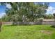 Expansive backyard with lush green grass and a sturdy wooden fence for privacy at 23253 Granite Pl, Land O Lakes, FL 34639