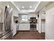Bright kitchen featuring stainless steel appliances, granite countertops, and wood flooring at 23253 Granite Pl, Land O Lakes, FL 34639
