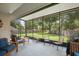 Relaxing screened porch with comfortable seating, perfect for enjoying the outdoors at 23253 Granite Pl, Land O Lakes, FL 34639