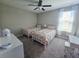 Bright bedroom with twin beds, a desk, and natural light at 238 Argyll Dr, Spring Hill, FL 34609