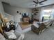 Cozy living room featuring tile floors and comfortable seating arrangement at 238 Argyll Dr, Spring Hill, FL 34609
