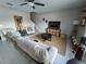 Bright living room featuring neutral paint, tile flooring, and comfortable seating at 238 Argyll Dr, Spring Hill, FL 34609