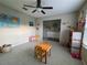 Bright living area with tile flooring, a ceiling fan, view to another room, and furniture for activities at 238 Argyll Dr, Spring Hill, FL 34609