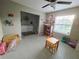 Bright living area with tile flooring, window, furniture for activities, and adjacent closet space at 238 Argyll Dr, Spring Hill, FL 34609