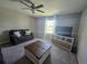 Cozy living room featuring a TV, shelving unit, and natural light at 238 Argyll Dr, Spring Hill, FL 34609