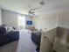 Comfortable living room with a ceiling fan and a window providing natural light at 238 Argyll Dr, Spring Hill, FL 34609