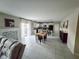 Spacious open-concept living room with fireplace and views into the modern kitchen at 238 Argyll Dr, Spring Hill, FL 34609