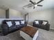 Inviting living room with plush sofas and a decorative wooden coffee table at 238 Argyll Dr, Spring Hill, FL 34609