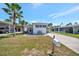 Charming single-story home with a well-manicured lawn and a covered carport, perfect for easy parking at 264 S Port Royal Ln, Apollo Beach, FL 33572
