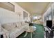 Spacious Florida room with comfortable seating, large glass table, and plenty of natural light at 264 S Port Royal Ln, Apollo Beach, FL 33572
