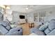 Comfortable living room with plush seating and a TV for relaxation and entertainment at 264 S Port Royal Ln, Apollo Beach, FL 33572