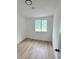 Cozy bedroom with new floors, a bright window and neutral paint at 26448 Eager Rd, Punta Gorda, FL 33955