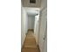 Hallway with multiple doors and wood flooring at 26448 Eager Rd, Punta Gorda, FL 33955