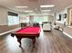 Spacious clubhouse offers billiard table, ample seating and natural lighting at 28451 Great Bend Pl, Wesley Chapel, FL 33543
